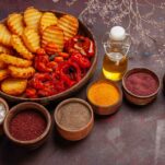 top view baked potatoes with different seasonings on dark background vegetable food cooking meal dinner